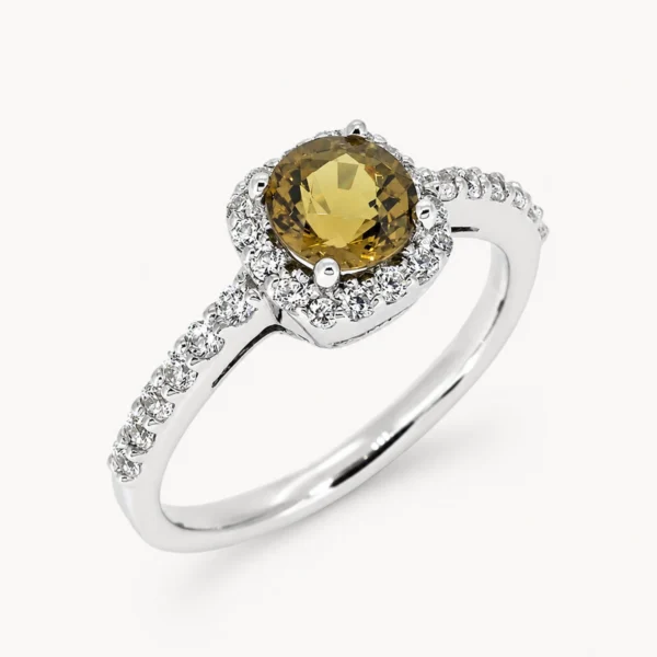 Anillo de oro blanco con turmalina central y diamantes en orla y brazo