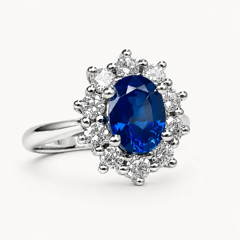 Anillo de platino con zafiro azul natural y orla de diamantes naturales